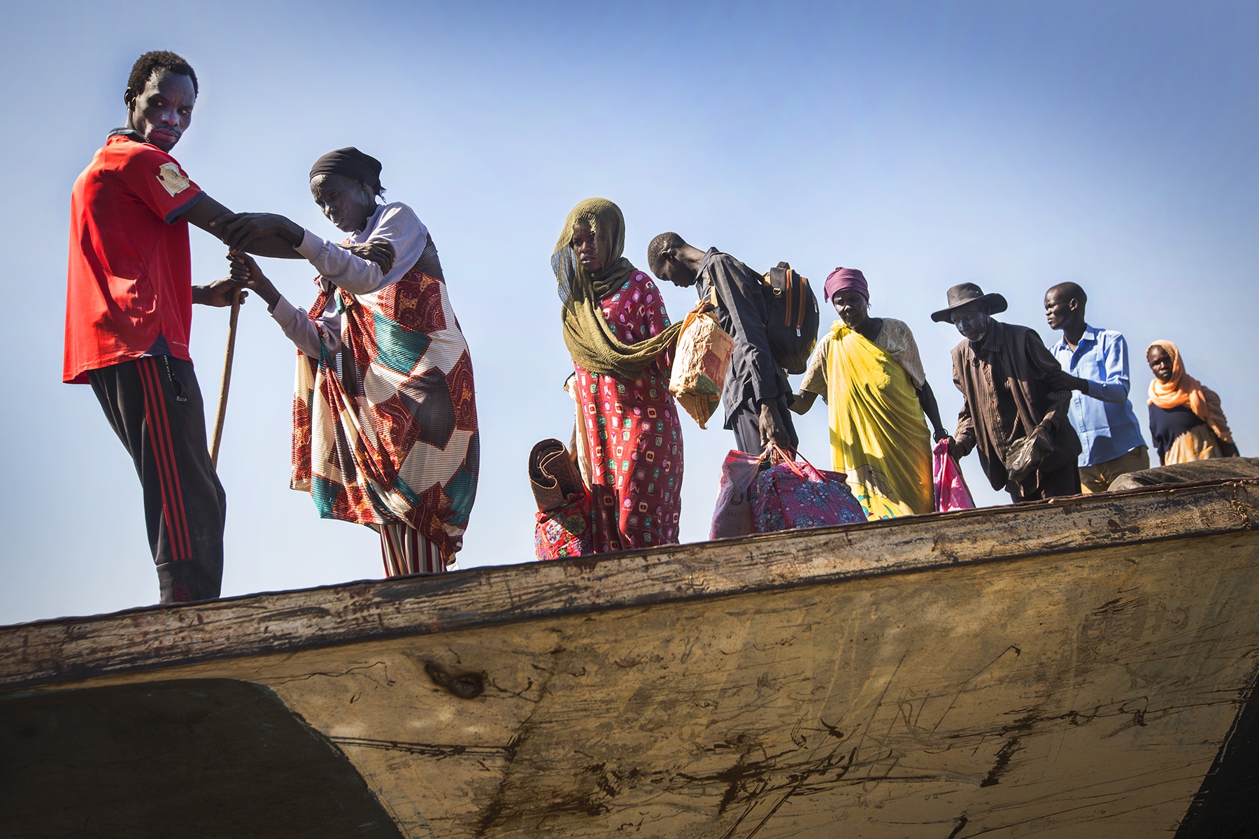 Chris Hildreth photograph of blind patients traveling by boat to surgical outreach in South Sudan