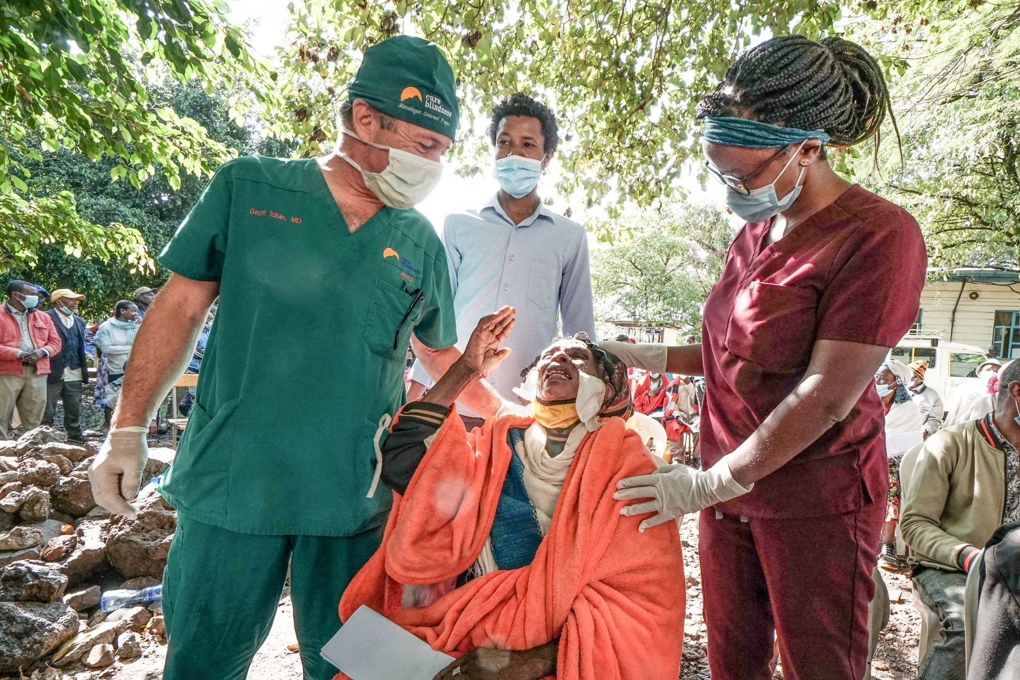 Dr. Wanja Mathenge and Dr. Geoff Tabin celebrate with an Ethiopian patient in 2021. Photo Credit: Christopher Briscoe