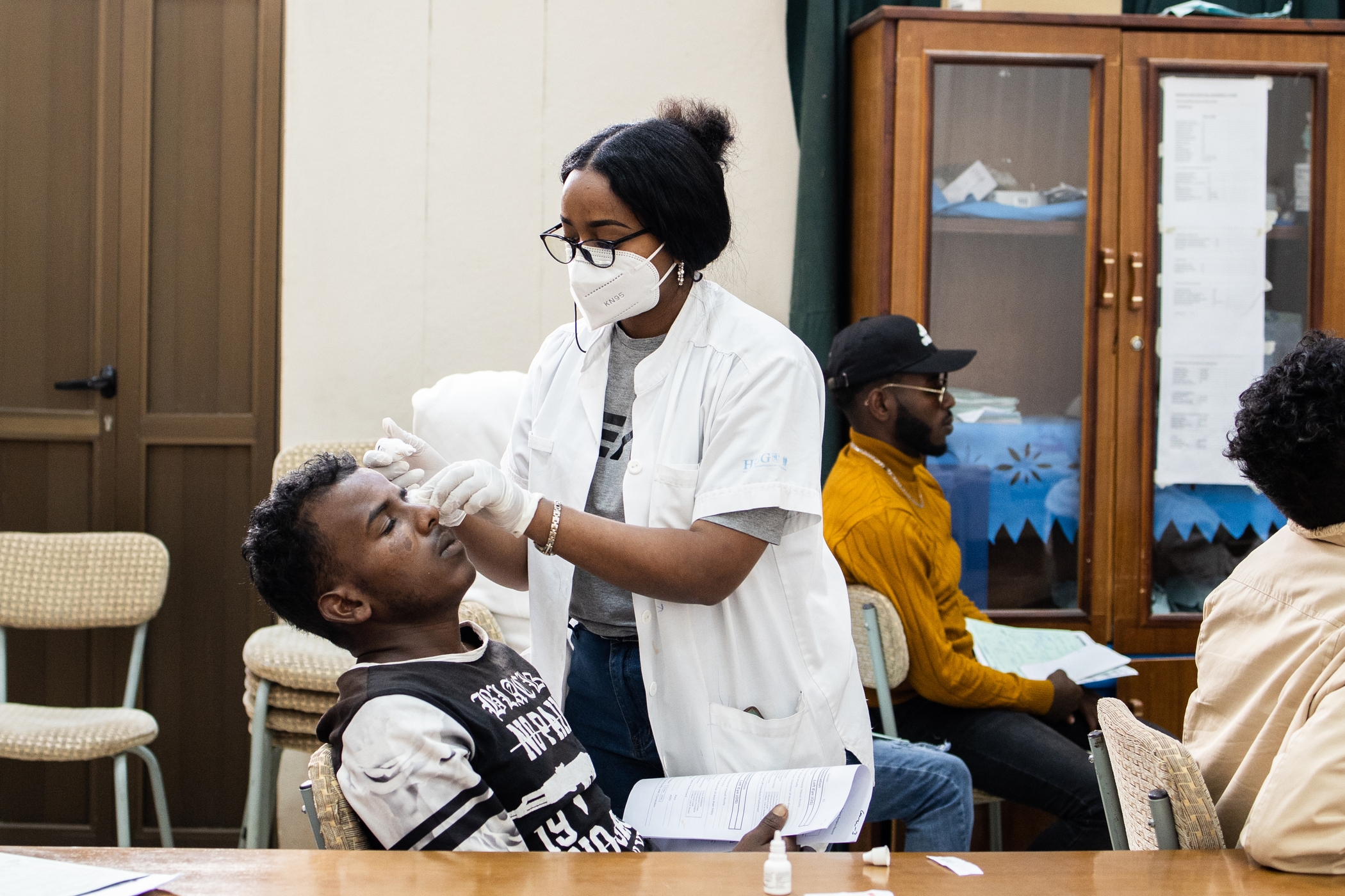 Cornea transplants require medicated drops following surgery to aid in the healing process. Here Nurse Niyat applies drops to Ahmed’s eye.