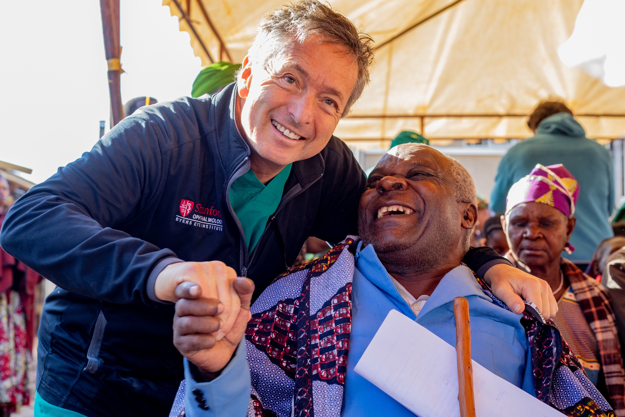 Tanzanian plumber John Mpozayo with Cure Blindness Project co-founder Dr. Geoff Tabin