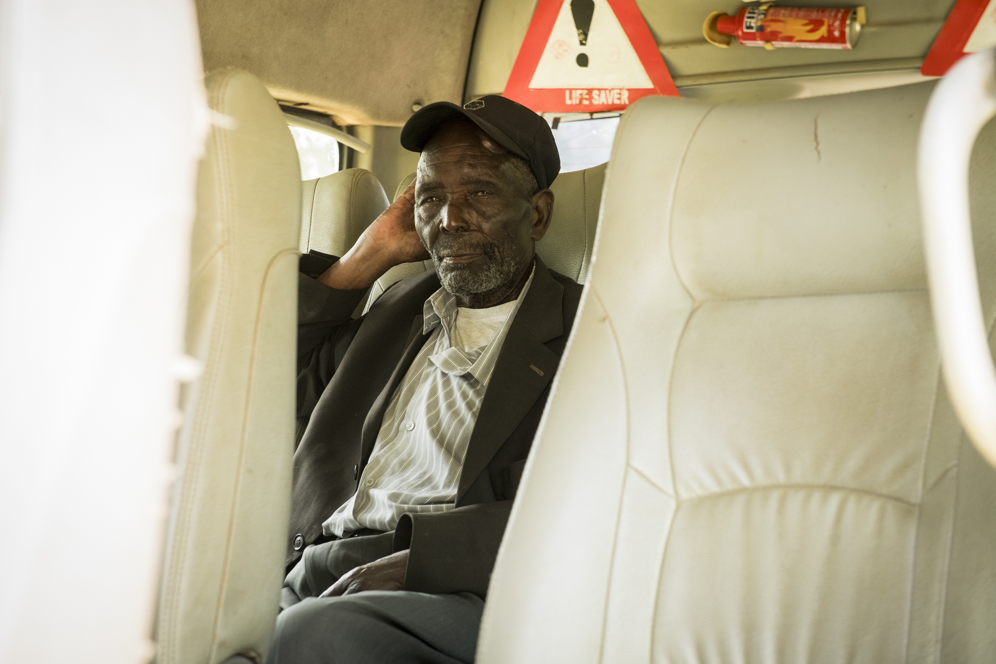 Paul waits as the van picks up another patient for surgery.